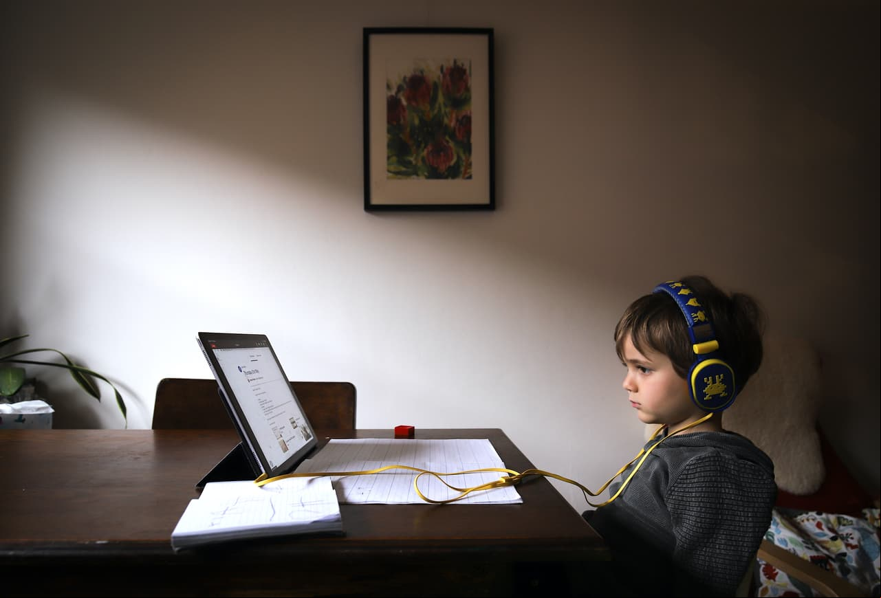 SYDNEY, AUSTRALIA - MAY 21: Six-year-old Kaya Atayman sits in front of his computer as he does homeschooling at his home in the suburb of Bondi on May 21, 2020 in Sydney, Australia. Students in New South Wales return to regular lessons today, after a week of staggered lessons, as COVID-19 restrictions ease across Australia. (Photo by David Gray/Getty Images)